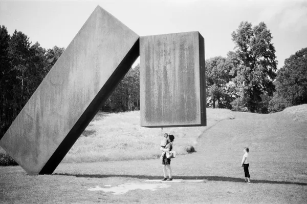 family under sculpture